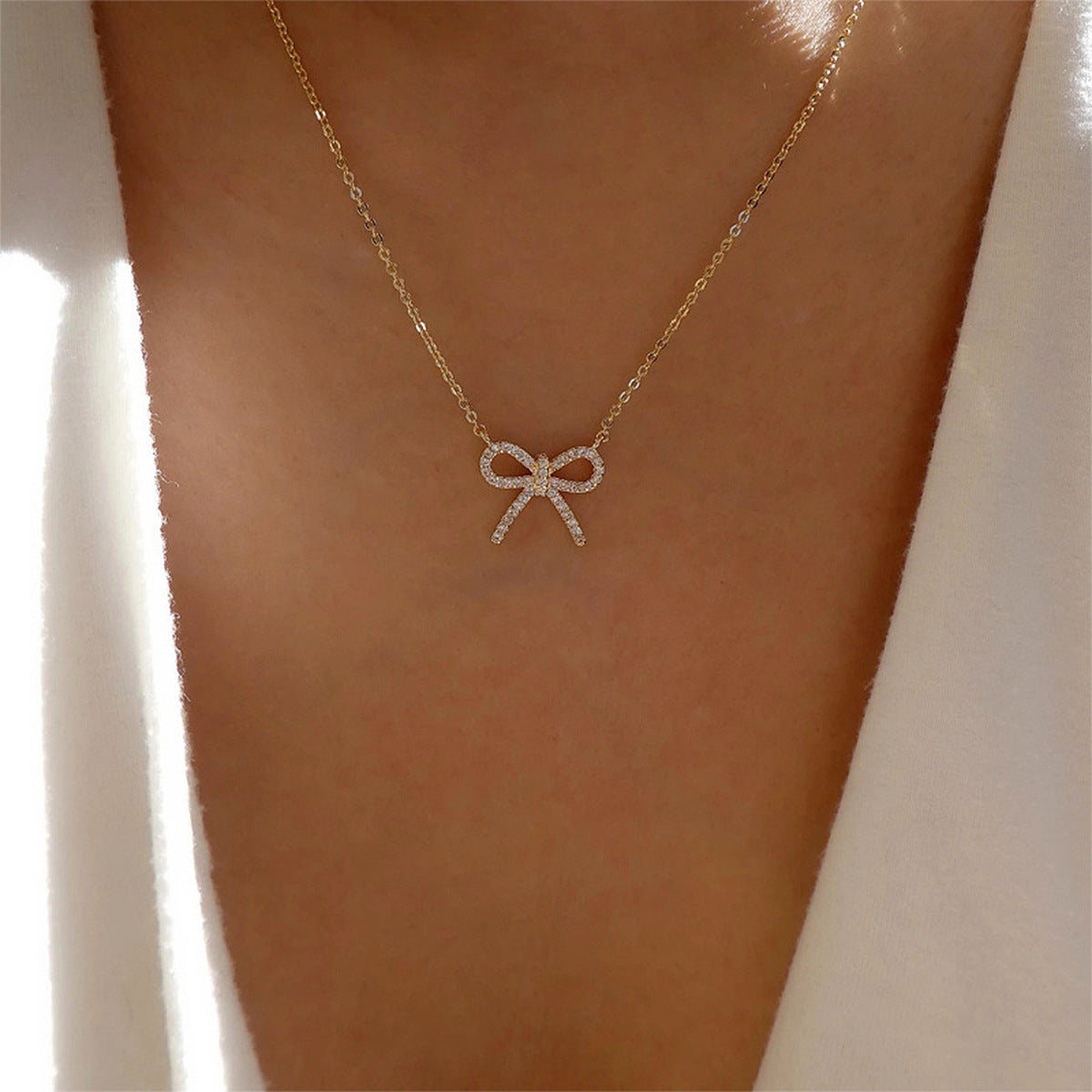 Aurora goudkleurige ketting met strik
