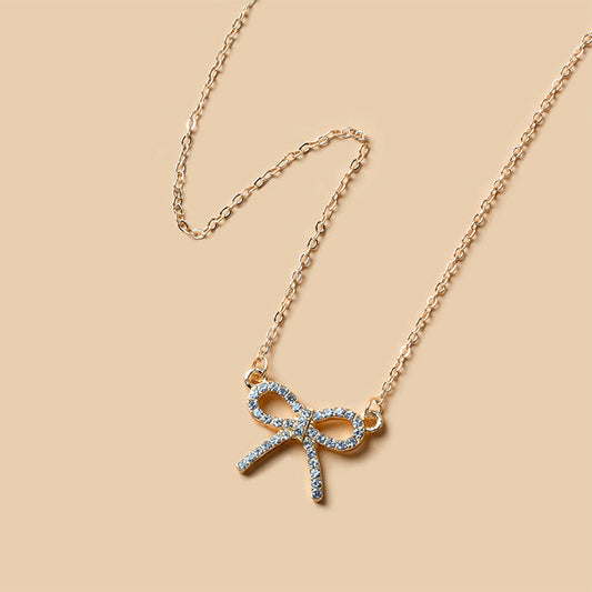 Aurora goudkleurige ketting met strik